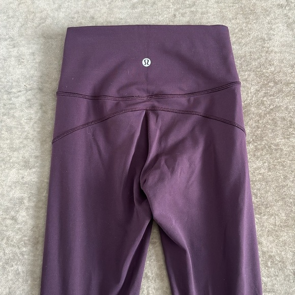 Lululemon In Movement tight. Inseam 25 inches. Color- eggplant. Size- 2 - Picture 4 of 8